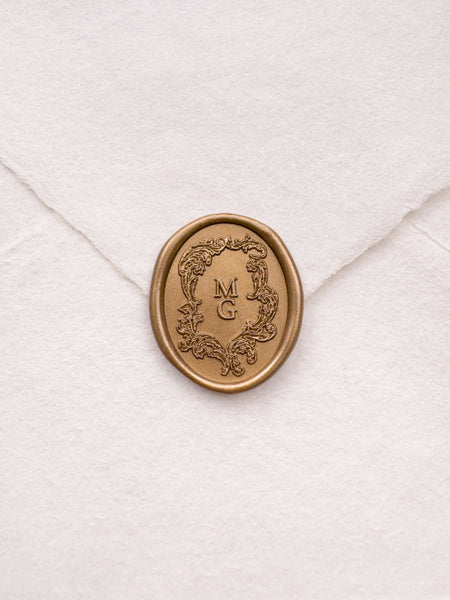 gold vintage crest personalized initials wax seal on a white envelope