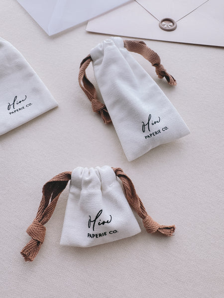 small and standard size wax seal stamp storage pouches with brown drawstrings 