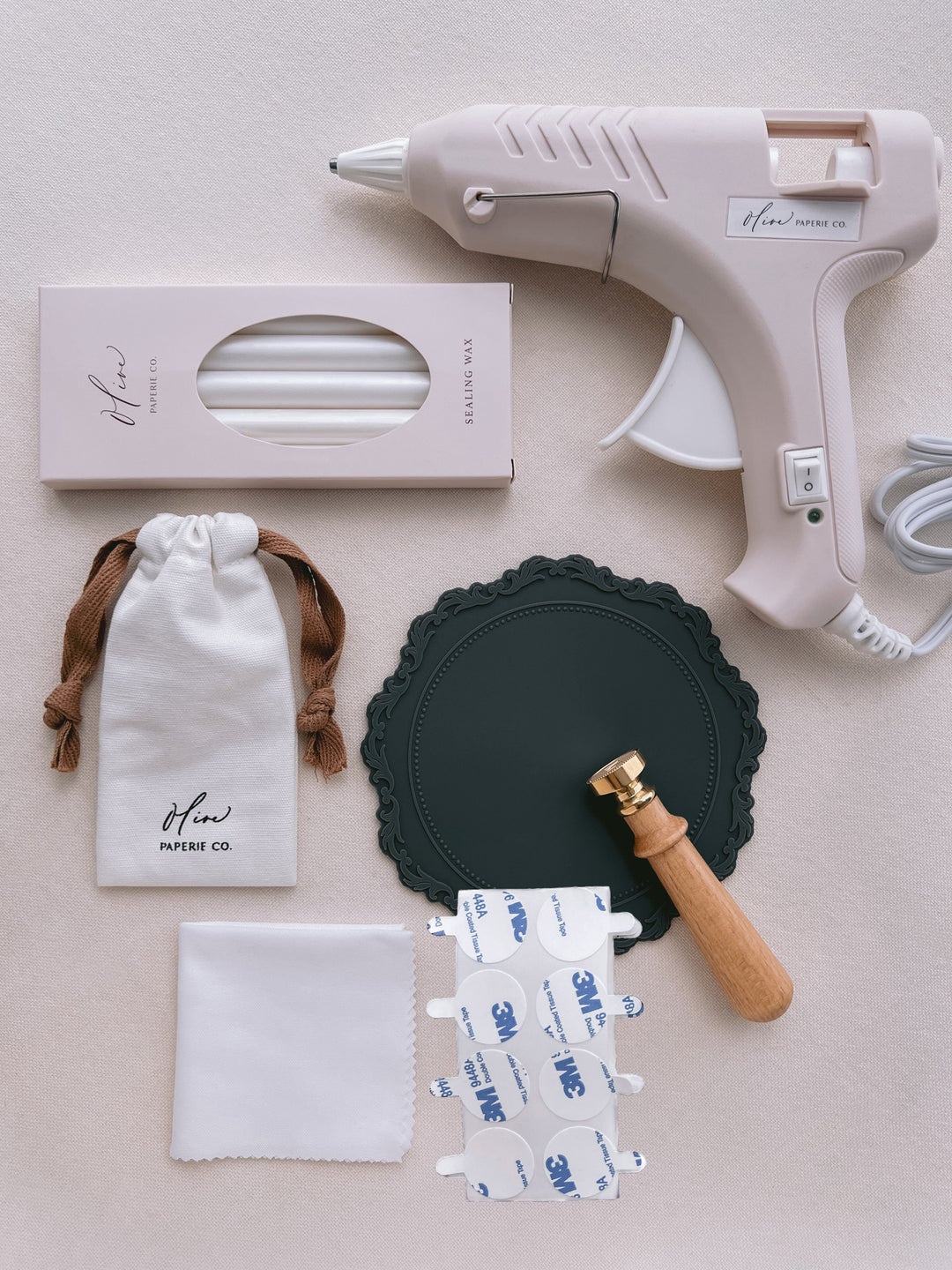 flat lay of wax seal stamp and wax seal supplies from the wax seal kit