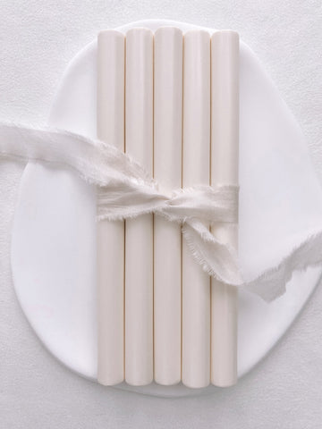 A set of 5 off-white glue gun sealing wax sticks tied with soft white silk ribbon 