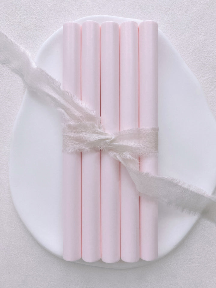 a set of 5 light blush color sealing wax sticks