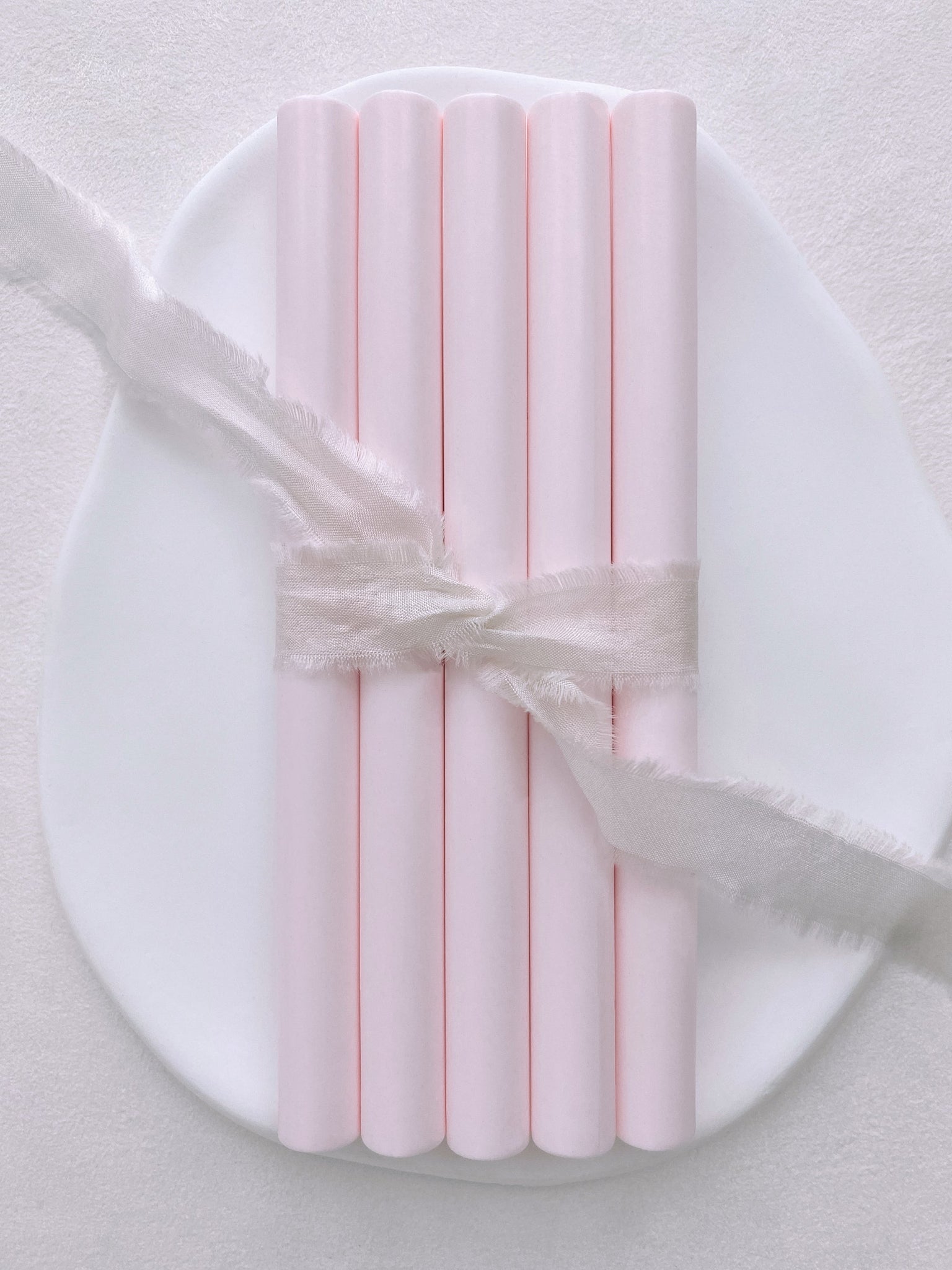 a set of 5 light blush color sealing wax sticks