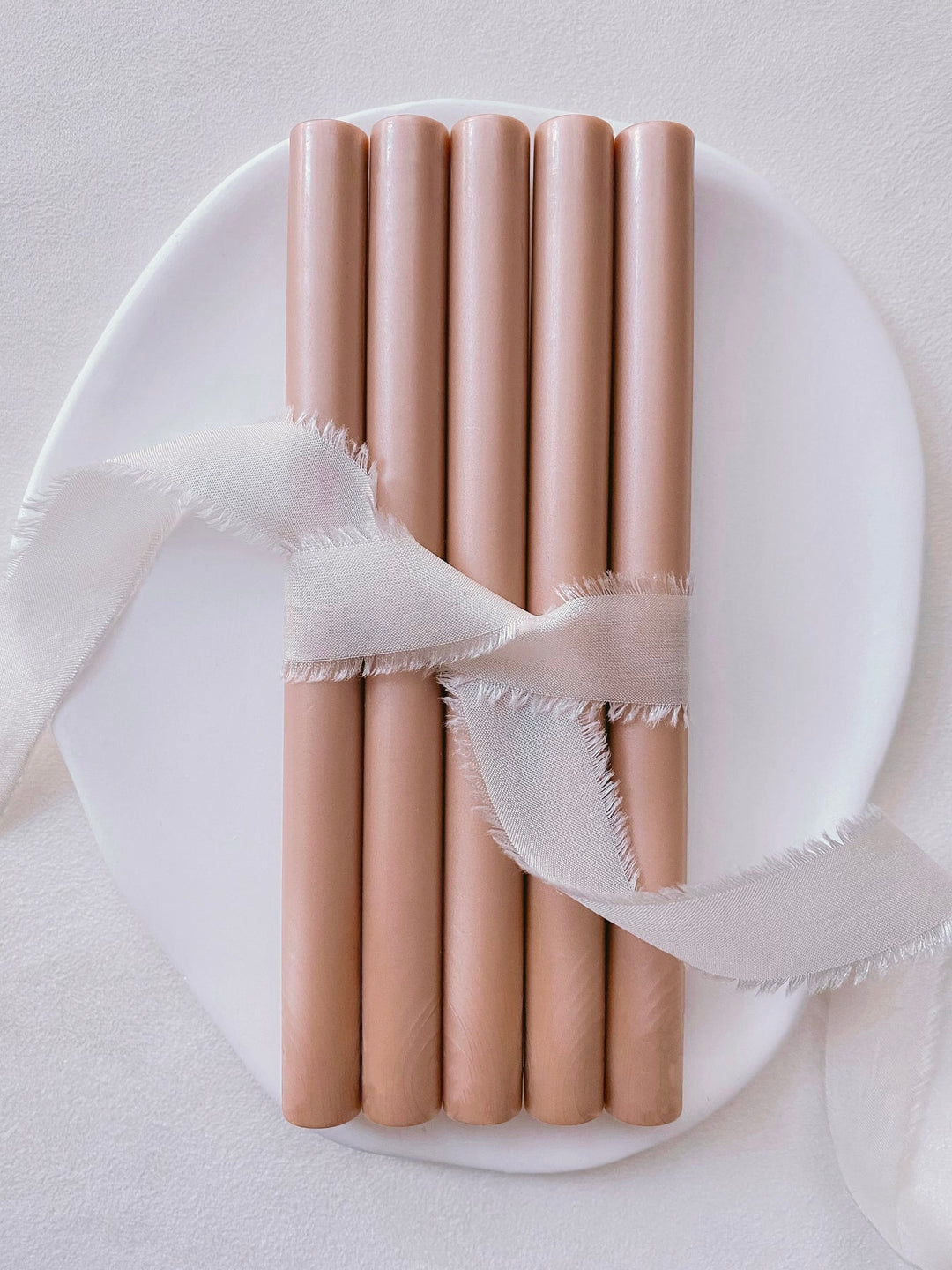 a set of 5 coral color sealing wax sticks