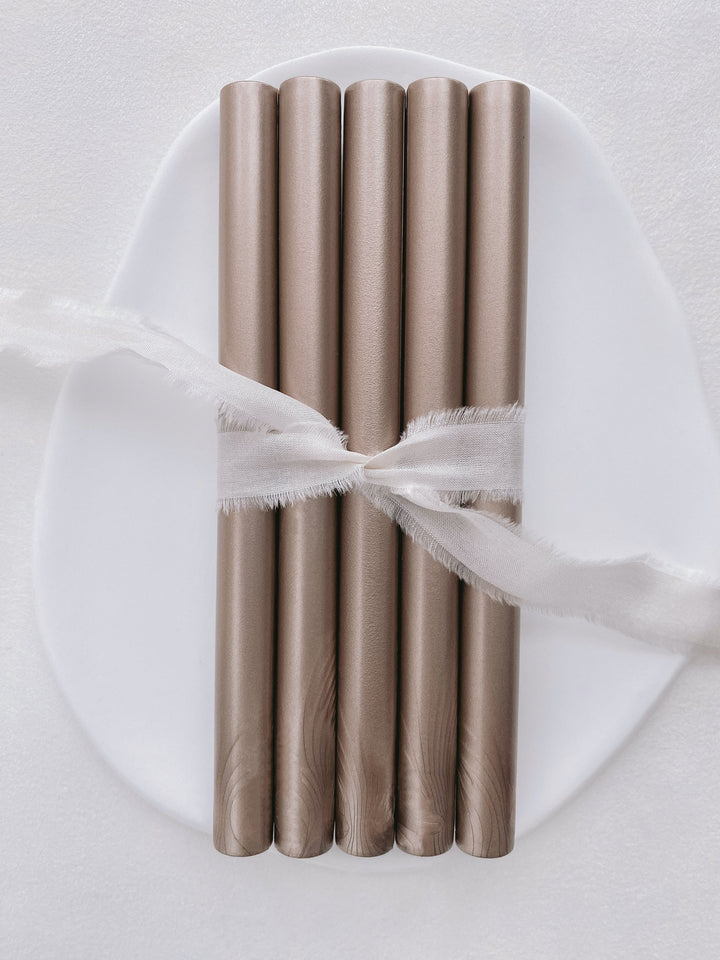 a set of 5 mocha glue gun sealing wax sticks tied with soft white silk ribbon