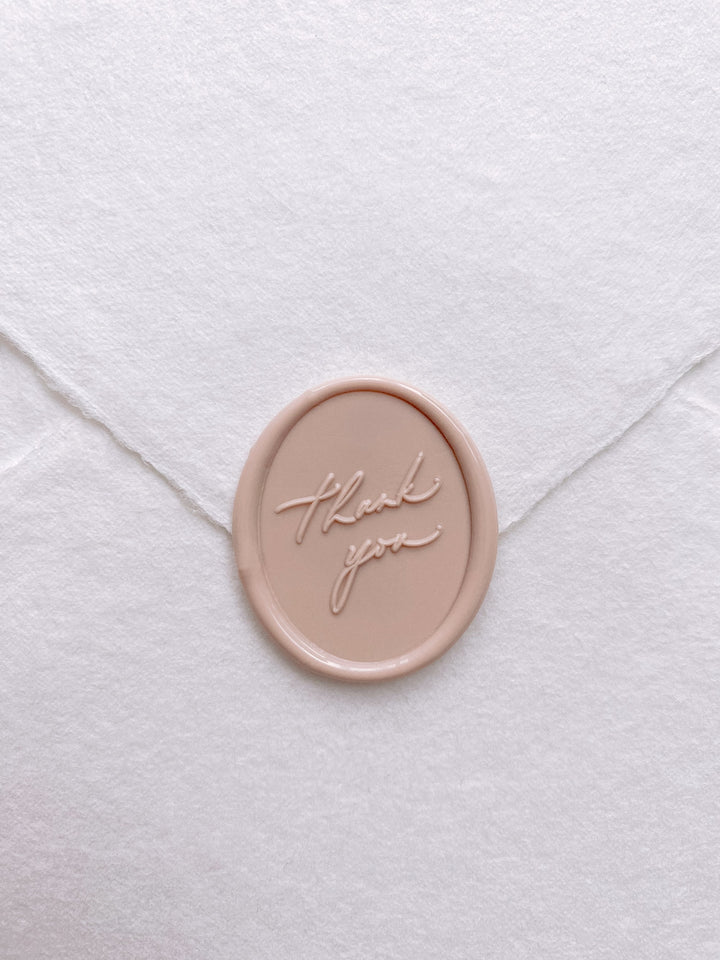 Oval thank you wax seal in nude on white handmade paper envelope