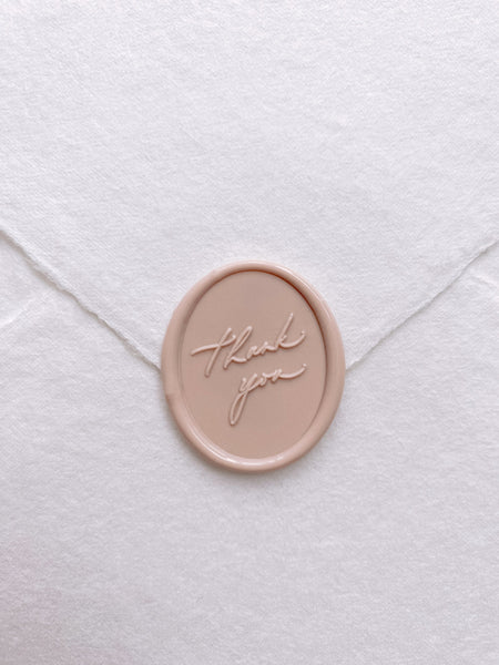 Oval thank you wax seal in nude on handmade paper envelope