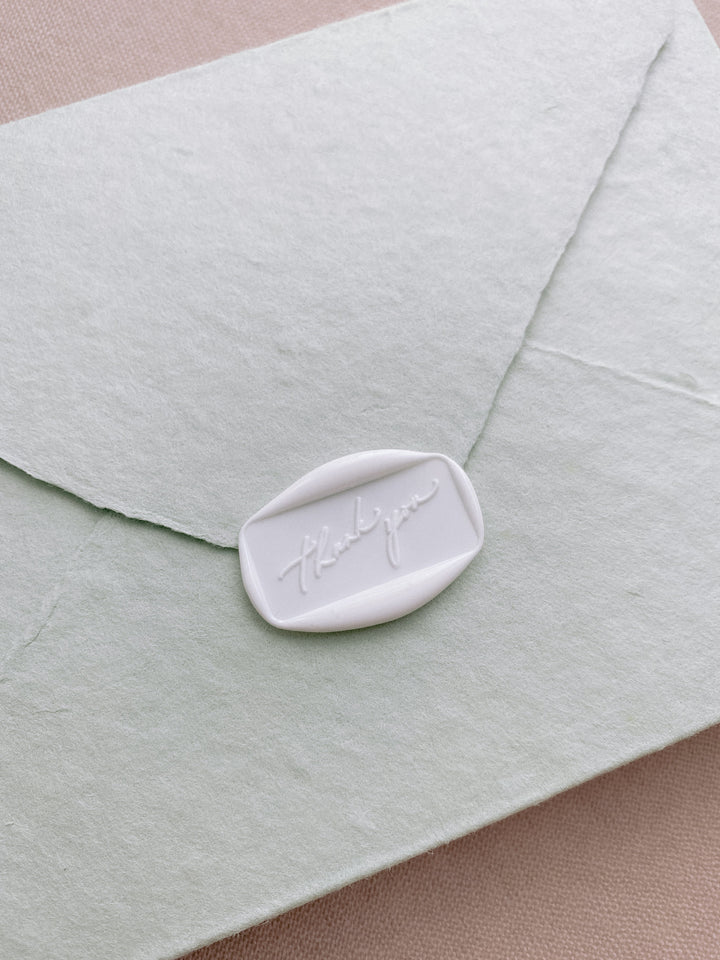 Floral Thank you rectangular wax seal in soft white on handmade paper envelope_side angle
