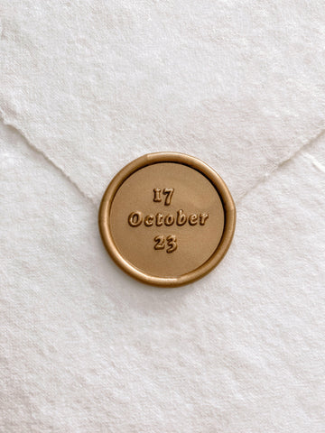 Personalized wedding date round gold custom wax seal on beige handmade paper envelope