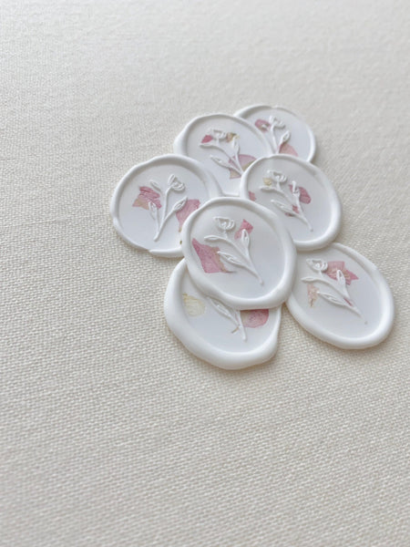 white oval wax seal stickers with blush color dried petals