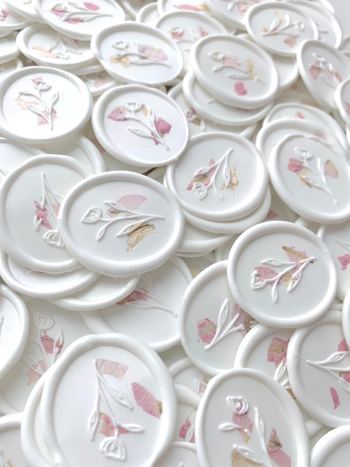 a bundle of white oval wax seal sticker with blush color dried petals