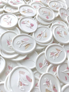 a bundle of white oval wax seal sticker with blush color dried petals