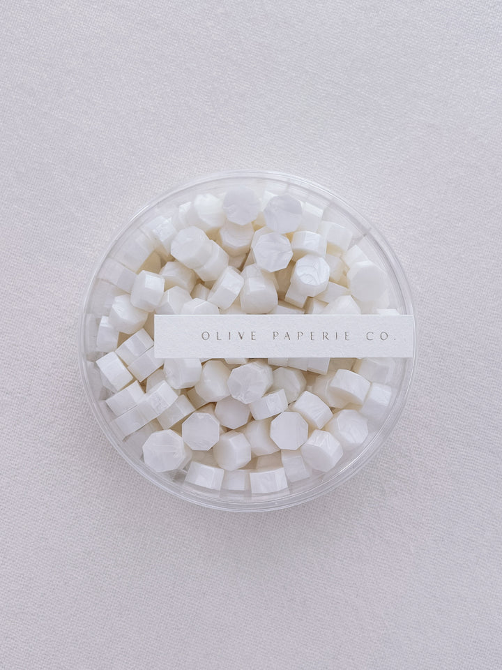 Pearl white sealing wax beads in a clear container box
